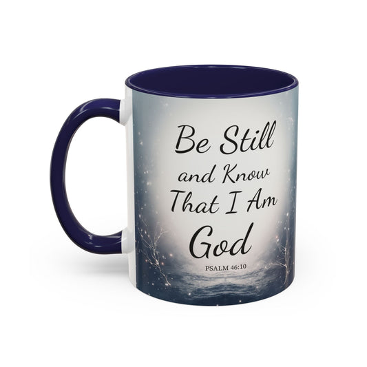 Inspirational coffee mug with Psalm 46:10 "Be Still and Know That I Am God" design and navy blue handle and interior