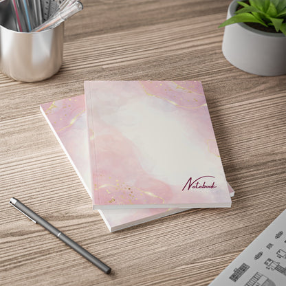 Pink & Gold Swirl Notebook A5 size with elegant gold-accented cover on wooden desk