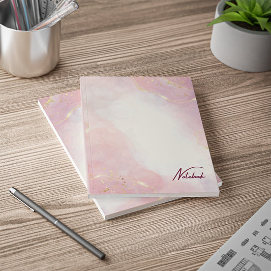 Pink & Gold Swirl Notebook A5 size with elegant gold-accented cover on wooden desk