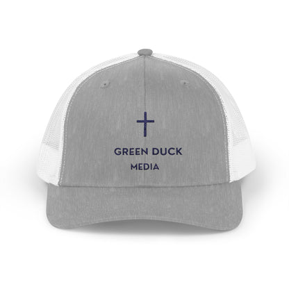 White and navy Cross Logo Trucker Hat with breathable mesh and embroidered cross design by Green Duck Media