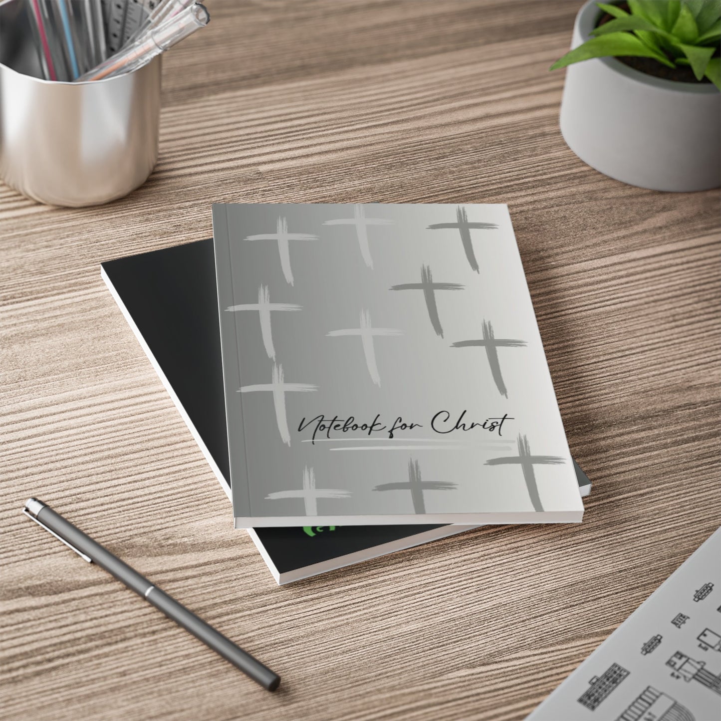 A5 Notebook for Christ with grey cover and cross patterns for Christian Bible study and prayer notes on wooden desk