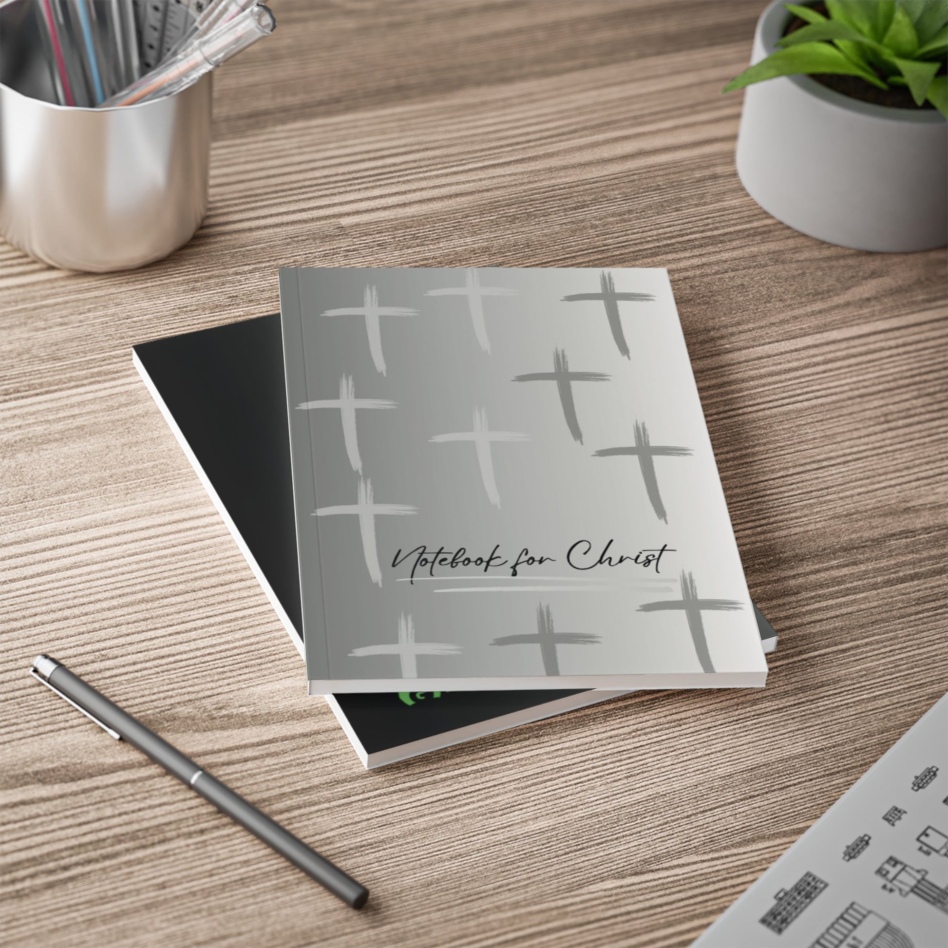 A5 Notebook for Christ with grey cover and cross patterns for Christian Bible study and prayer notes on wooden desk