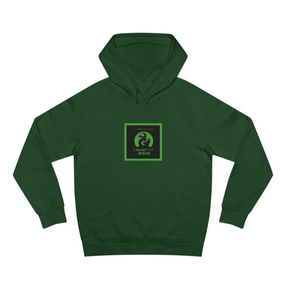 Unisex premium green hoodie with "an EYE for design a HEART for JESUS" faith-inspired graphic and kangaroo pocket