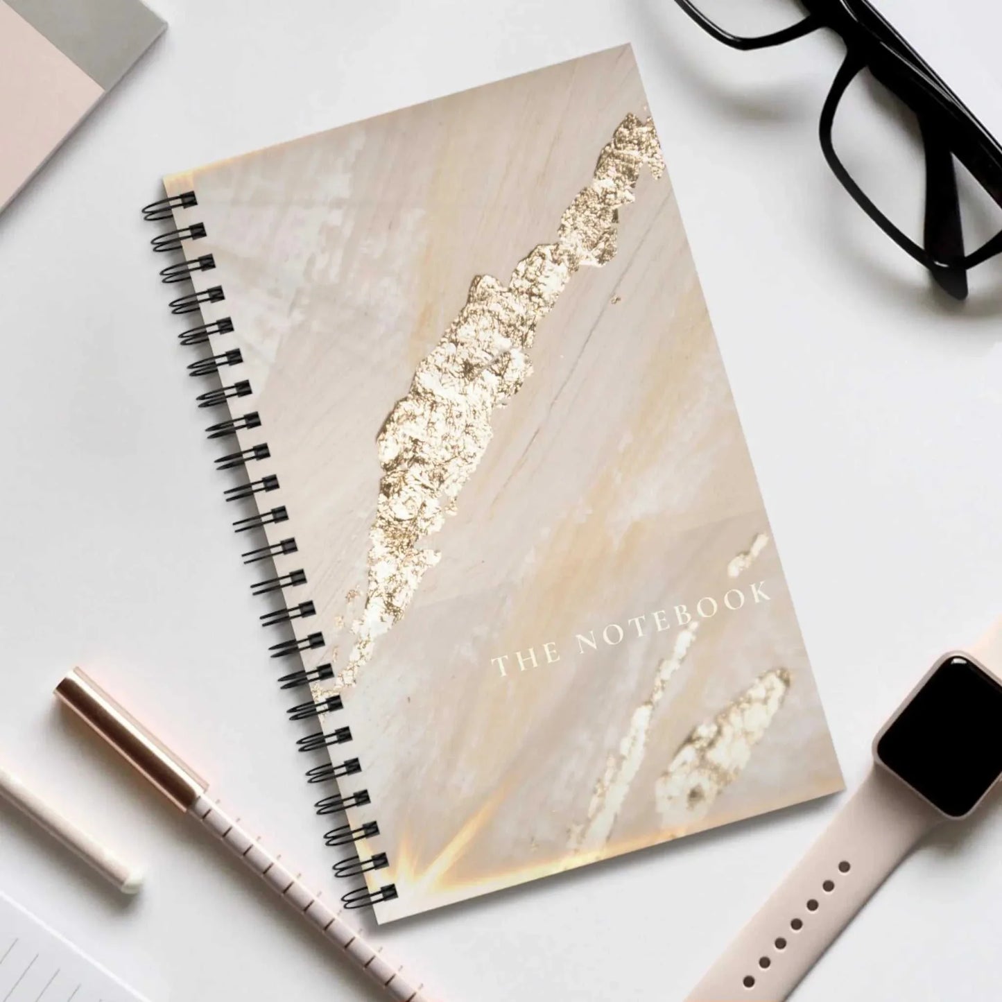 Ruled notes spiral notebook with elegant marble design and metal binding for students and writers